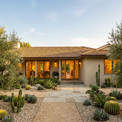 Single-story ranch house with a desert garden and a stone path